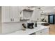 Kitchen counter with coffee bar, pendant lights, and decorative accents at 4040 E Becker Ln, Phoenix, AZ 85028