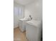 Bright laundry room with washer and dryer, featuring neutral colors at 4040 E Becker Ln, Phoenix, AZ 85028