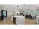 Bright and airy living room featuring modern lighting, and open concept floor plan, with white kitchen island at 4040 E Becker Ln, Phoenix, AZ 85028