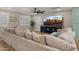 Inviting living room with a comfortable sectional sofa and large TV at 4040 E Becker Ln, Phoenix, AZ 85028