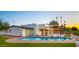 Stunning backyard pool with brick trim, surrounded by artificial grass and a pergola-covered patio at 4040 E Becker Ln, Phoenix, AZ 85028