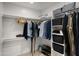 Well-organized walk-in closet with ample hanging space, shelving, and storage bins at 4040 E Becker Ln, Phoenix, AZ 85028