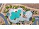 Resort style community pool with splashpad and seating areas for residents at 40479 W Marion May Ln, Maricopa, AZ 85138