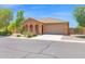 Charming single-story home featuring a tile roof, desert landscaping, and a two-car garage at 40479 W Marion May Ln, Maricopa, AZ 85138