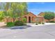Inviting single-story home with a tile roof, desert landscaping, and an arched entryway at 40479 W Marion May Ln, Maricopa, AZ 85138