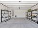 A spacious two-car garage that offers plenty of storage and utility hookups at 40479 W Marion May Ln, Maricopa, AZ 85138