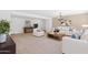 Bright living room featuring neutral tones, stylish furnishings, and modern decor at 40479 W Marion May Ln, Maricopa, AZ 85138