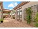 Charming backyard featuring gravel landscaping and a cozy covered patio area, perfect for relaxation at 40614 N Harbour Town Ct, Anthem, AZ 85086