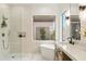 Spa-like bathroom featuring a freestanding tub, glass-enclosed shower, and outdoor view at 40614 N Harbour Town Ct, Anthem, AZ 85086