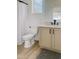 Neat bathroom features a toilet, vanity with a sink, and a shower behind a white curtain at 40614 N Harbour Town Ct, Anthem, AZ 85086