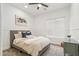 This bedroom has a neutral color palette, plush carpet, and is bright with lots of natural light at 40614 N Harbour Town Ct, Anthem, AZ 85086