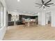 This spacious kitchen is a chef's dream, with black cabinets, a large island, and stainless steel appliances at 40614 N Harbour Town Ct, Anthem, AZ 85086