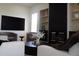 Bright living room showcasing a modern fireplace and stylish decor at 40614 N Harbour Town Ct, Anthem, AZ 85086