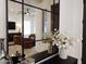 Reflective view of the modern living room with stylish chairs and decor at 40614 N Harbour Town Ct, Anthem, AZ 85086