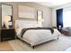 Serene main bedroom with a plush bed, modern lamps, and decorative accents at 40614 N Harbour Town Ct, Anthem, AZ 85086