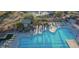 Aerial view of a community pool with cabanas and lounge chairs at 40614 N Harbour Town Ct, Anthem, AZ 85086