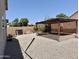 Expansive backyard featuring pergola, gravel landscaping and privacy walls at 4224 E Renee Dr, Phoenix, AZ 85050