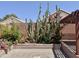 Landscaped backyard featuring desert plants, flowers and pergola on crushed gravel at 4224 E Renee Dr, Phoenix, AZ 85050