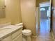 Bathroom with marble countertop, toilet, and access to the shower at 4224 E Renee Dr, Phoenix, AZ 85050