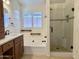 Elegant bathroom featuring a soaking tub, glass-enclosed shower, and modern fixtures, creating a spa-like retreat at 4224 E Renee Dr, Phoenix, AZ 85050