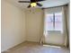Bedroom featuring a ceiling fan and a large window with curtains at 4224 E Renee Dr, Phoenix, AZ 85050