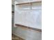 Walk-in closet with custom wood racks and shelving at 4224 E Renee Dr, Phoenix, AZ 85050