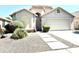 Well-kept home with a tiled roof, two-car garage, and xeriscaped front yard, perfect for low-maintenance living at 4224 E Renee Dr, Phoenix, AZ 85050