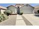 Attractive home with desert landscaping, a tile roof, and a two-car garage, presenting excellent curb appeal at 4224 E Renee Dr, Phoenix, AZ 85050