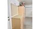 Attached garage with built-in wooden cabinets, workbench, and pegboard for storing tools and equipment at 4224 E Renee Dr, Phoenix, AZ 85050