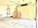 Attached garage with built-in wooden cabinets and a water heater at 4224 E Renee Dr, Phoenix, AZ 85050