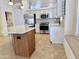 Bright kitchen featuring stainless steel appliances, modern cabinets, and a cozy window seat with backyard views at 4224 E Renee Dr, Phoenix, AZ 85050