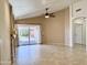 Spacious living room with high ceilings, neutral paint, tiled floors and backyard view through a glass slider at 4224 E Renee Dr, Phoenix, AZ 85050