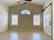 Large main bedroom with vaulted ceilings, stylish windows, and a sliding barn door for added privacy at 4224 E Renee Dr, Phoenix, AZ 85050