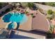 A high angle view of an outdoor living space with mature landscaping, pool, spa, patio and ample seating at 4264 S Columbine Way, Gold Canyon, AZ 85118