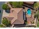 Aerial view of a tile roofed home featuring a sparkling pool, lush landscaping, and a private backyard oasis at 4264 S Columbine Way, Gold Canyon, AZ 85118