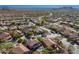 Bird's eye view showcases homes with private pools and lush landscaping in a serene community at 4264 S Columbine Way, Gold Canyon, AZ 85118
