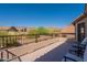 Expansive balcony with ample space, showcasing neighborhood views and beautiful desert landscaping at 4264 S Columbine Way, Gold Canyon, AZ 85118