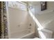 Bright bathroom features a shower over tub and natural light through a large window at 4264 S Columbine Way, Gold Canyon, AZ 85118