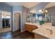 Bathroom featuring double sinks and a door to a walk-in closet at 4264 S Columbine Way, Gold Canyon, AZ 85118