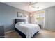 Comfortable bedroom with soft carpeting, a ceiling fan, and a large window for natural light at 4264 S Columbine Way, Gold Canyon, AZ 85118