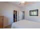 Cozy bedroom featuring a ceiling fan, closet, and a neutral color palette at 4264 S Columbine Way, Gold Canyon, AZ 85118