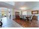 Elegant dining room featuring hardwood floors, a chandelier, and natural light, perfect for entertaining at 4264 S Columbine Way, Gold Canyon, AZ 85118