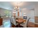 Formal dining room featuring hardwood floors, a decorative light fixture, and seating for six people at 4264 S Columbine Way, Gold Canyon, AZ 85118