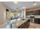 Stylish kitchen with a granite countertop island and stainless steel appliances at 4264 S Columbine Way, Gold Canyon, AZ 85118