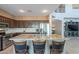 Spacious kitchen with granite counters, a central island with seating, and stainless steel appliances at 4264 S Columbine Way, Gold Canyon, AZ 85118