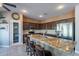 Modern kitchen with granite countertops, stainless steel appliances, and bar stool seating at 4264 S Columbine Way, Gold Canyon, AZ 85118