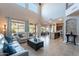 Open-concept living room with tile floors, soaring windows, and backyard views at 4264 S Columbine Way, Gold Canyon, AZ 85118