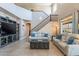 Open living room features a staircase, high ceilings, and large windows for plenty of light at 4264 S Columbine Way, Gold Canyon, AZ 85118
