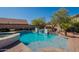 Backyard pool and spa featuring a sparkling pool, water features, lush landscaping, and a private oasis at 4264 S Columbine Way, Gold Canyon, AZ 85118