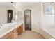 Bathroom featuring double sinks and a bathtub at 4427 W Powell Dr, New River, AZ 85087
